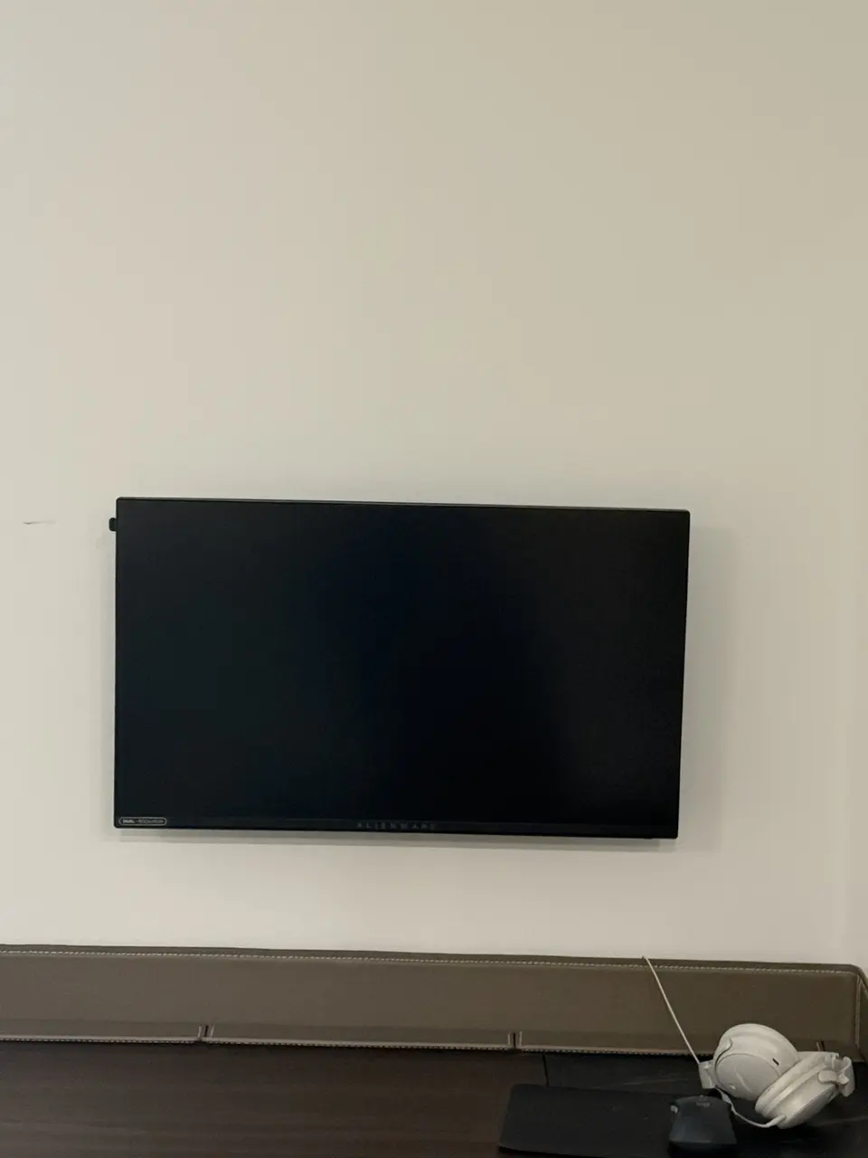 Computer monitor mounted on a condo wall
