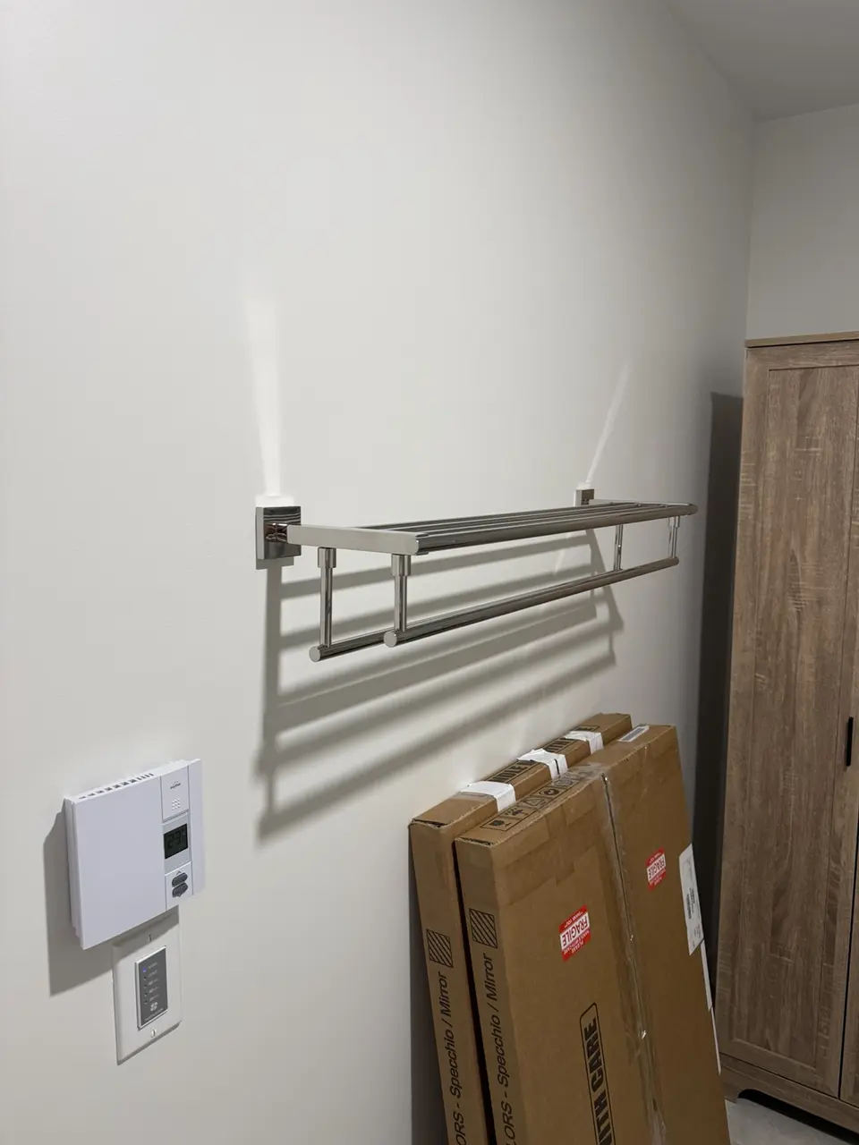 Towel rack installed on a bathroom wall